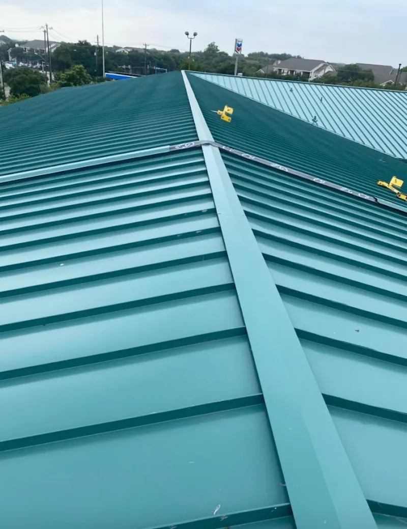 Green commercial metal roof ridge and valley for Metal Roof Repair in Oak Creek